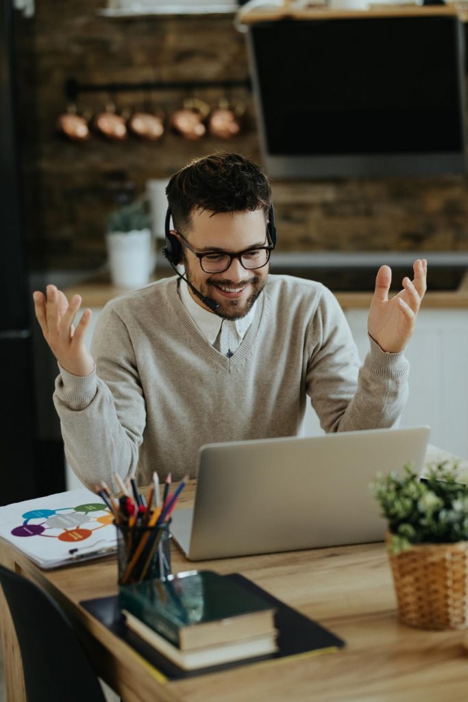 young-happy-entrepreneur-having-video-call-computer-home